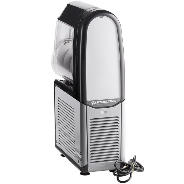 A Stoelting frozen beverage machine with a clear container and black and silver accents.