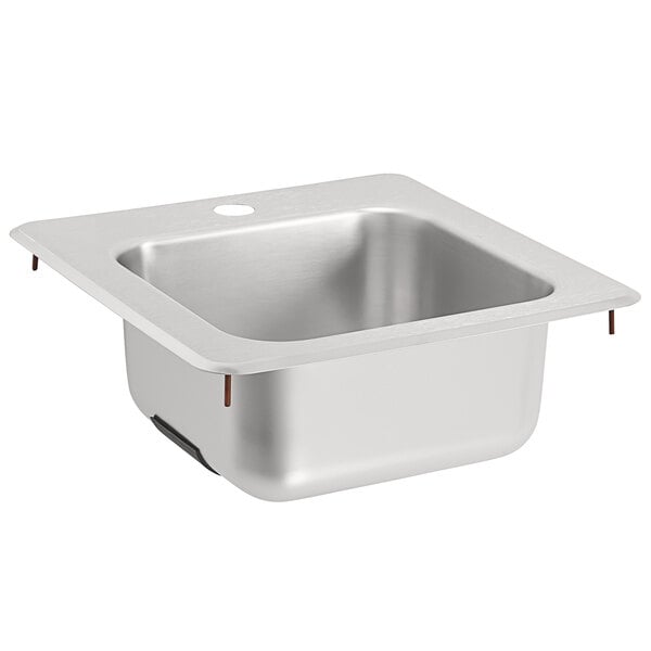 A silver Vollrath stainless steel sink with a hole in the bottom.