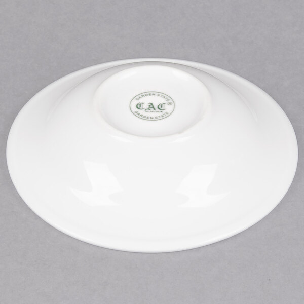 A white porcelain monkey dish with a logo on it.