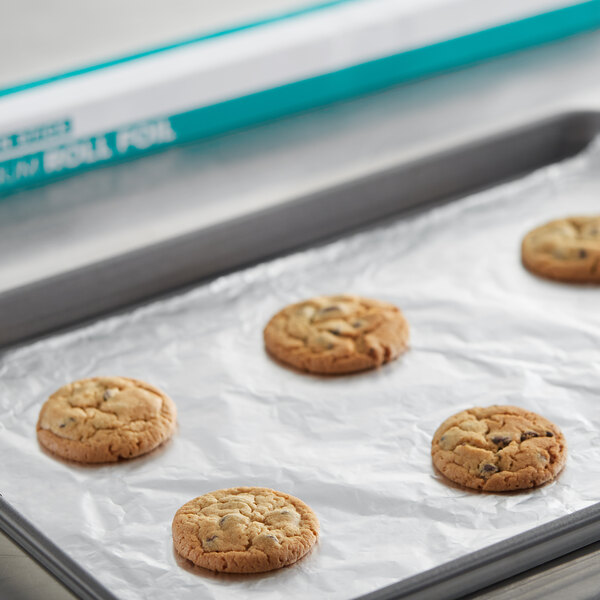 A tray of Choice aluminum foil wrapped cookies on a baking sheet.