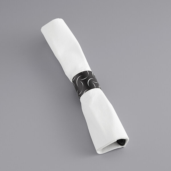 A white napkin with a black band on it.