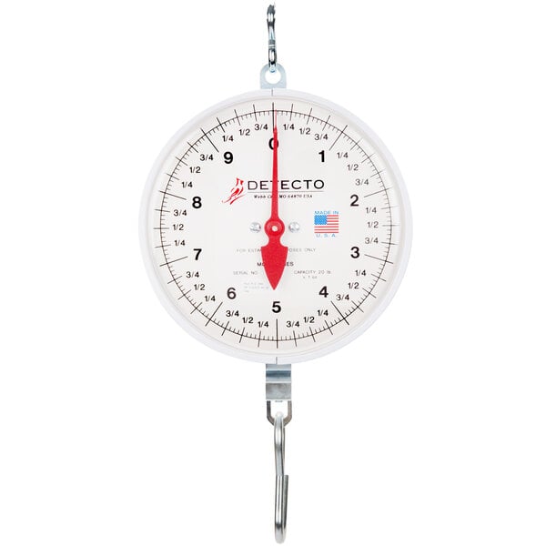 A Cardinal Detecto hanging hook scale with a white scale and red needle.
