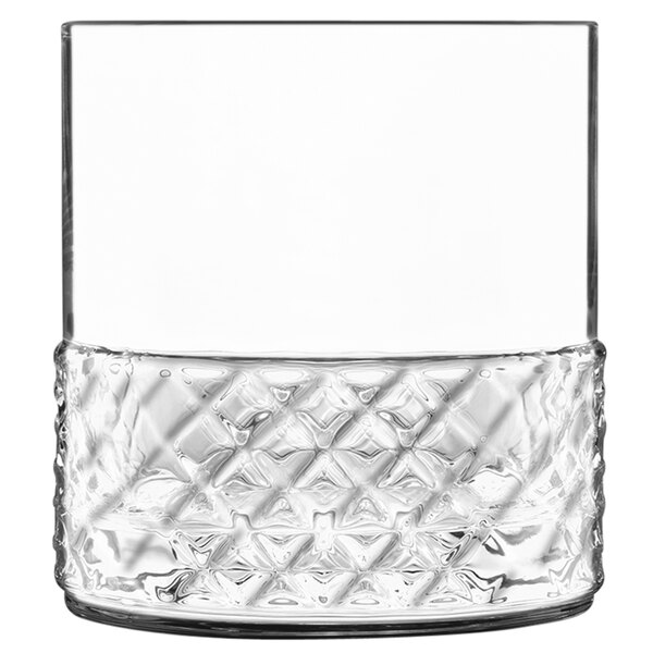 A close-up of a Luigi Bormioli Roma Rocks glass with a diamond pattern.