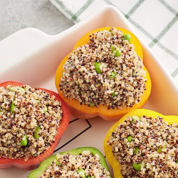 A group of peppers stuffed with Furmano's tri-color quinoa and peas.