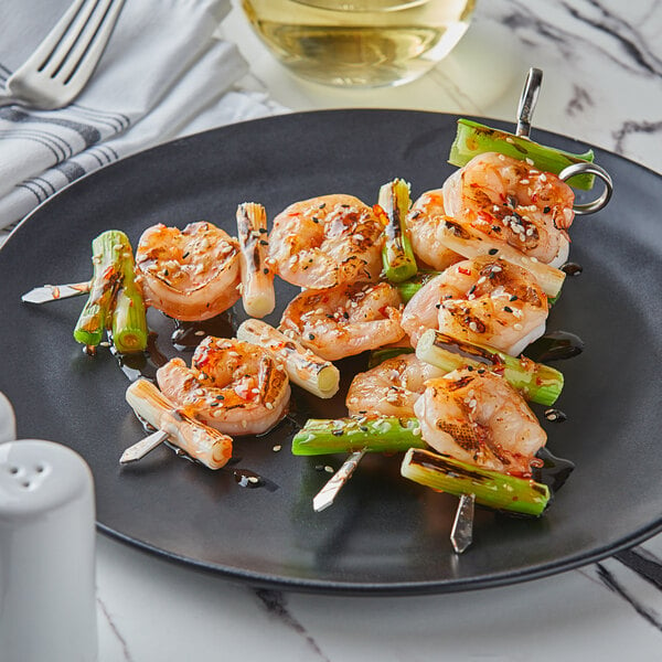 A shrimp skewer paired with green vegetables