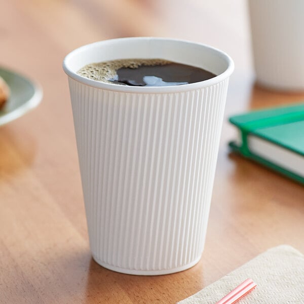 A Choice white double wall paper hot cup of coffee on a table.