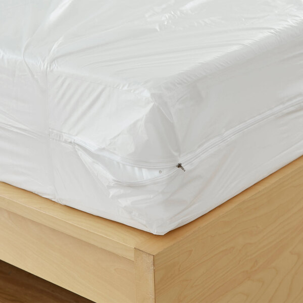 A Bargoose king-sized mattress with a white plastic vinyl cover on it.