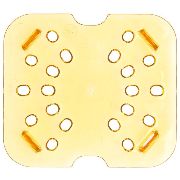 A yellow plastic plate with holes.