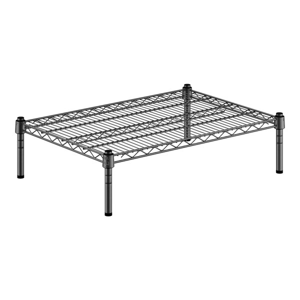 A black metal shelf with black metal legs.