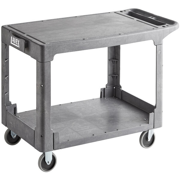 A grey Lavex utility cart with shelves and wheels.