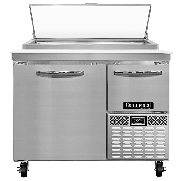 A large stainless steel Continental Refrigerator with one full door and one half door on a counter.
