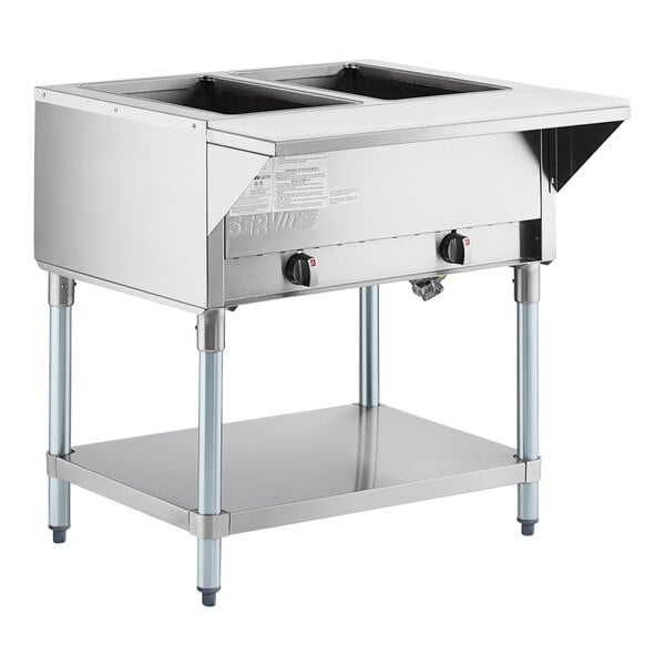 A stainless steel ServIt liquid propane steam table with undershelf.