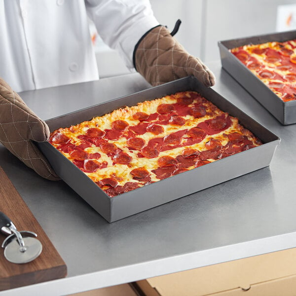 deep dish pizza in rectangular hard coat aluminum pan