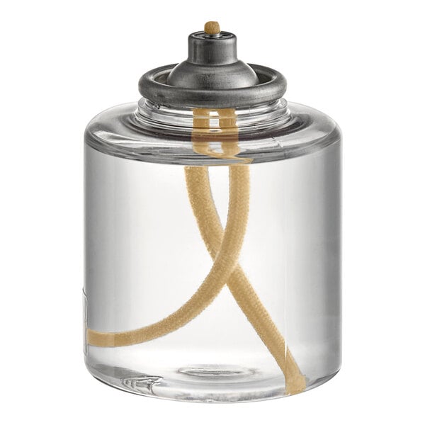 A clear glass container with Hollowick clear liquid fuel cartridges inside.