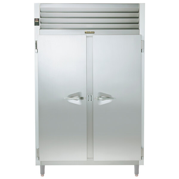 A Traulsen stainless steel two section reach-in refrigerator with double doors.