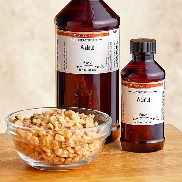 A bowl of walnuts and a bottle of super strength walnut oil.