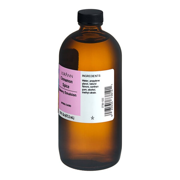 A 16 fl. oz. amber bottle of LorAnn Oils Cinnamon Spice Bakery Emulsion with a black cap and labeled ingredients.