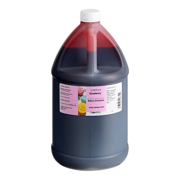 A large plastic jug with a red cap filled with red liquid.
