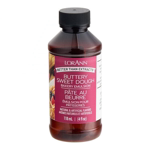 A bottle of LorAnn Oils Buttery Sweet Dough Bakery Emulsion on a counter.