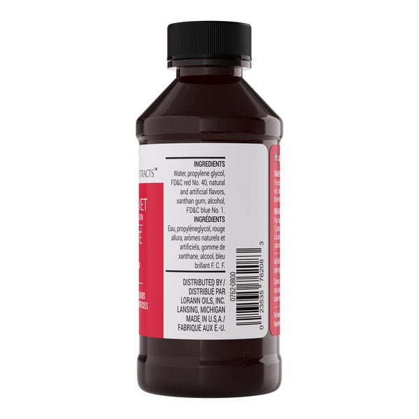 A 4 fl. oz. bottle of LorAnn Oils Red Velvet Bakery Emulsion with a black cap and ingredient label visible.
