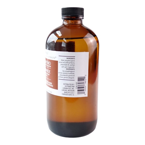 A brown glass bottle with a black cap containing LorAnn Oils 16 fl. oz. Almond Bakery Emulsion.
