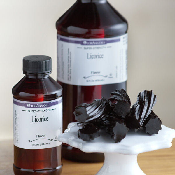 A bottle of LorAnn Oils 16 fl. oz. Licorice Super Strength Flavor on a counter.