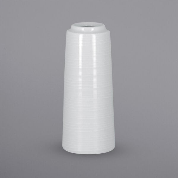 A white cylindrical vase with embossed flowers.