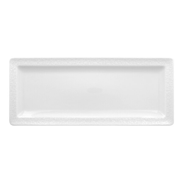 A bright white embossed rectangular flat porcelain plate.