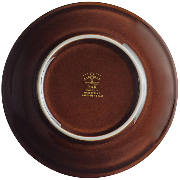 A brown porcelain coupe plate with a white rim.