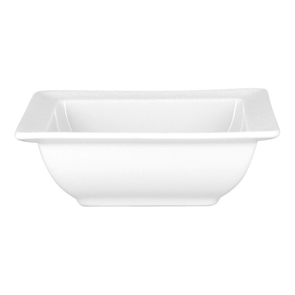 A bright white embossed square porcelain salad bowl.