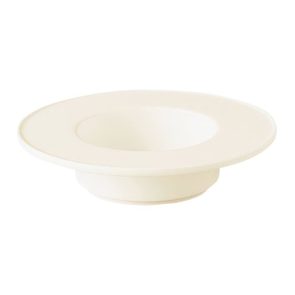 A white saucer with a white rim.