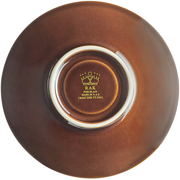 A brown porcelain saucer with a white rim.