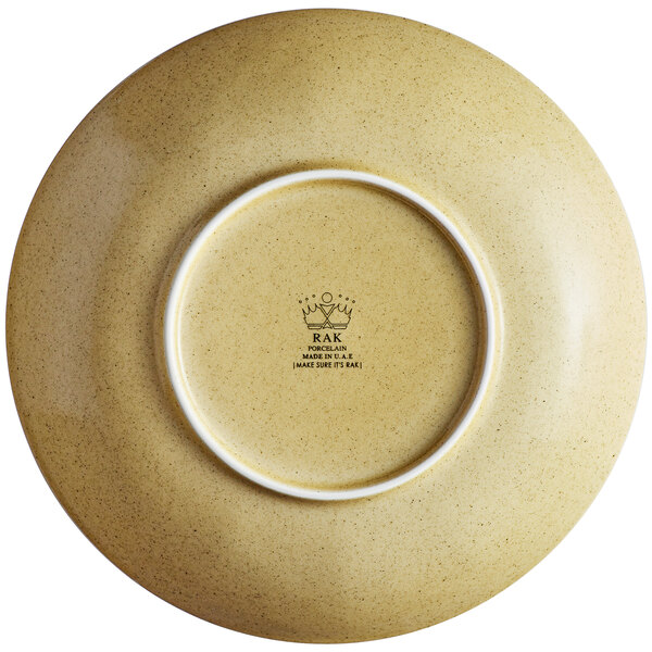 A close up of a RAK Porcelain Creme Brule deep porcelain coupe plate with a white rim.