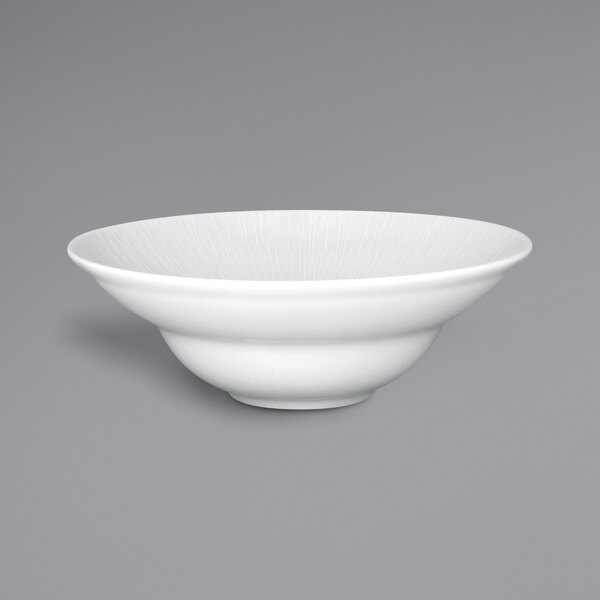 a white bowl on a gray background