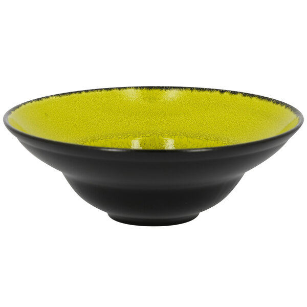 A green porcelain plate with a wide rim.