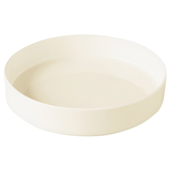 A RAK Porcelain warm white porcelain plate with a curved rim on a white background.