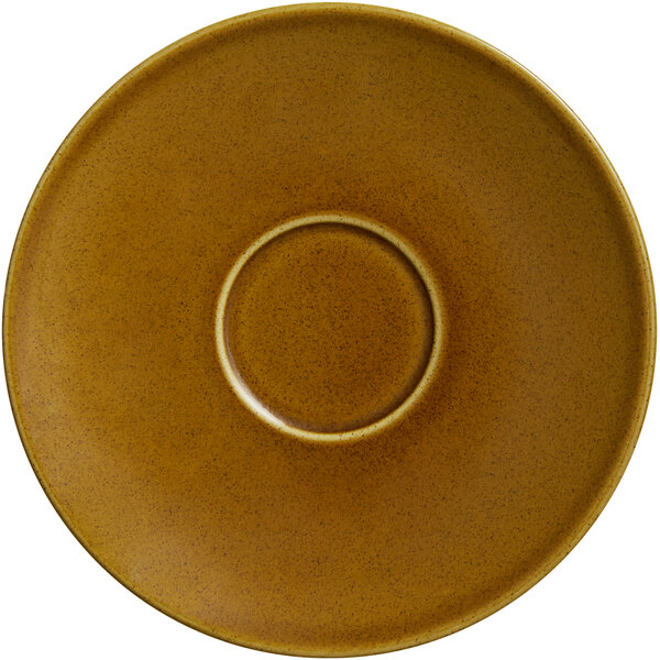 A brown RAK Porcelain saucer with a circle in the middle.