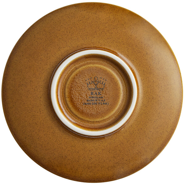 A brown porcelain saucer with a white rim.