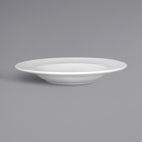 A RAK Porcelain bright white porcelain plate with an embossed rim.