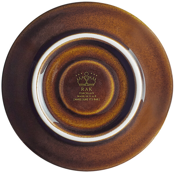 A brown porcelain saucer with a white rim.