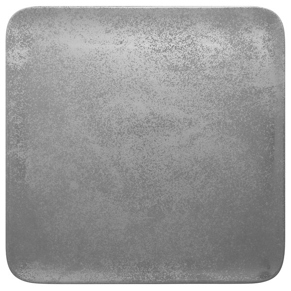 A close-up of a RAK Porcelain square grey plate with specks.