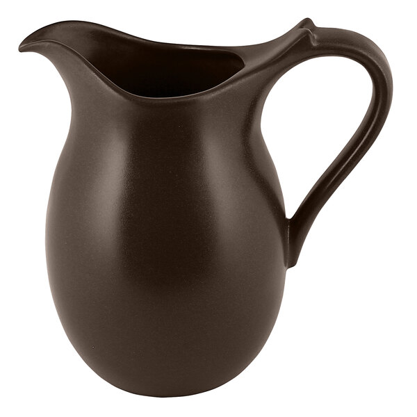 A brown RAK Porcelain jug with a handle.