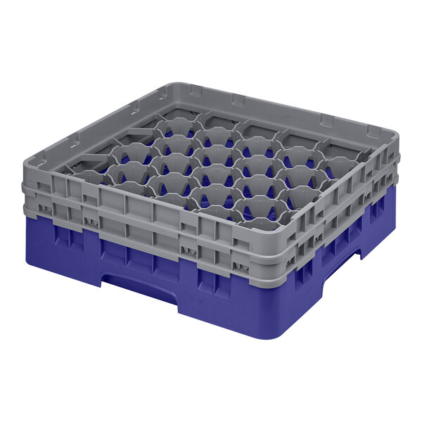 A navy blue plastic Cambro glass rack with 30 compartments.