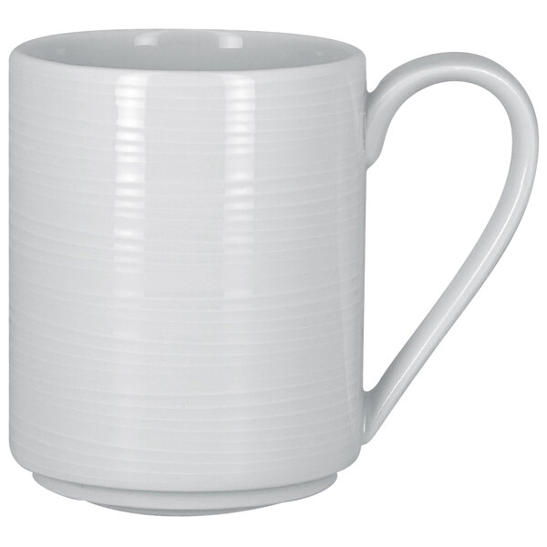 A close-up of a RAK Porcelain white mug with a white handle.