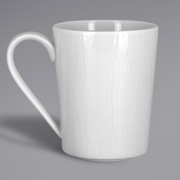 A white RAK Porcelain mug with a handle.