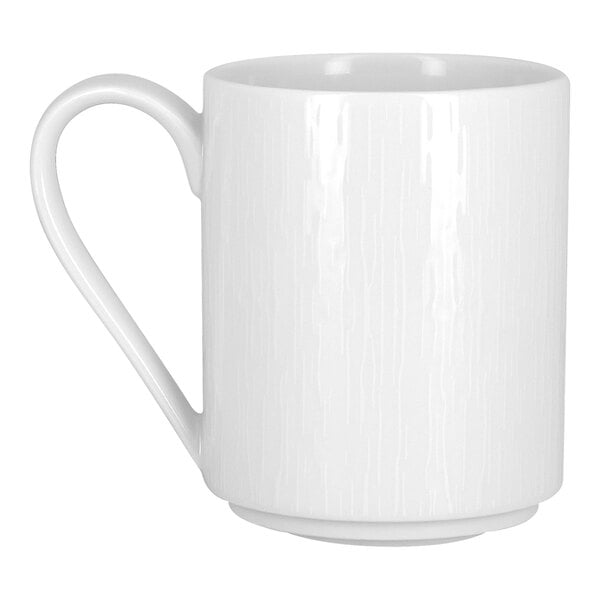 A bright white embossed stackable porcelain mug with a handle.