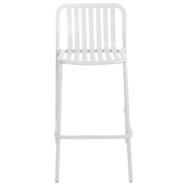 A white BFM Seating Key West bar stool with a metal frame and a vertical slat backrest.