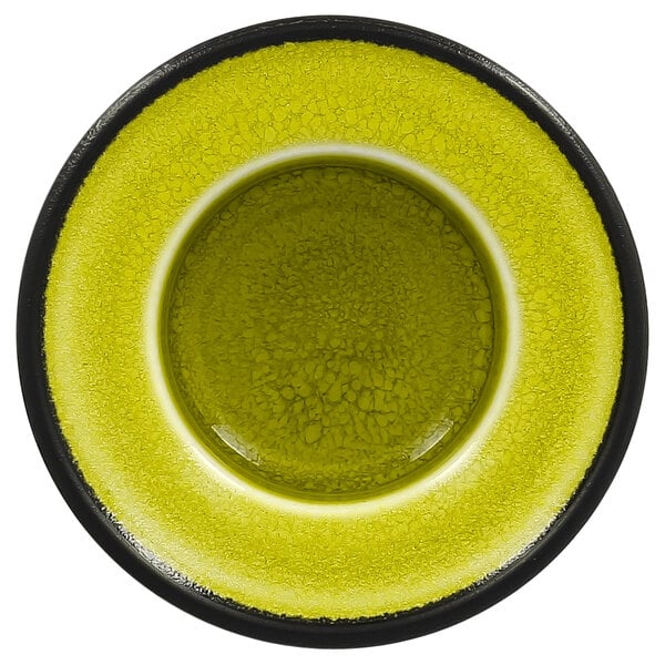 A close up of a green RAK Porcelain saucer with a black rim.