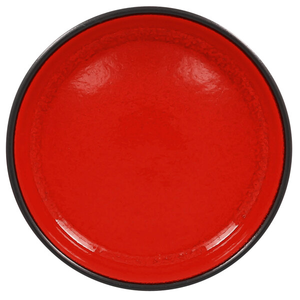 A red porcelain bowl with a white interior and black rim.