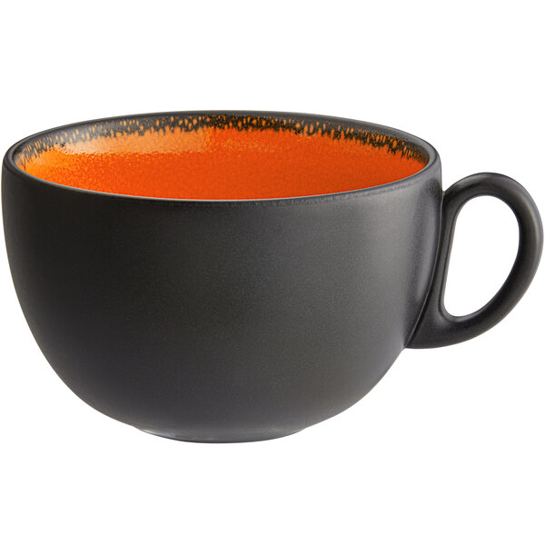 A black and orange porcelain breakfast cup with a handle.